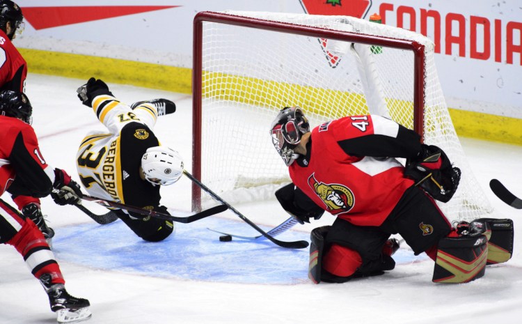 Ottawa goaltender Craig Anderson makes a save on Bruins center Patrice Bergeron in the first period Tuesday night in Ottawa, Ontario.