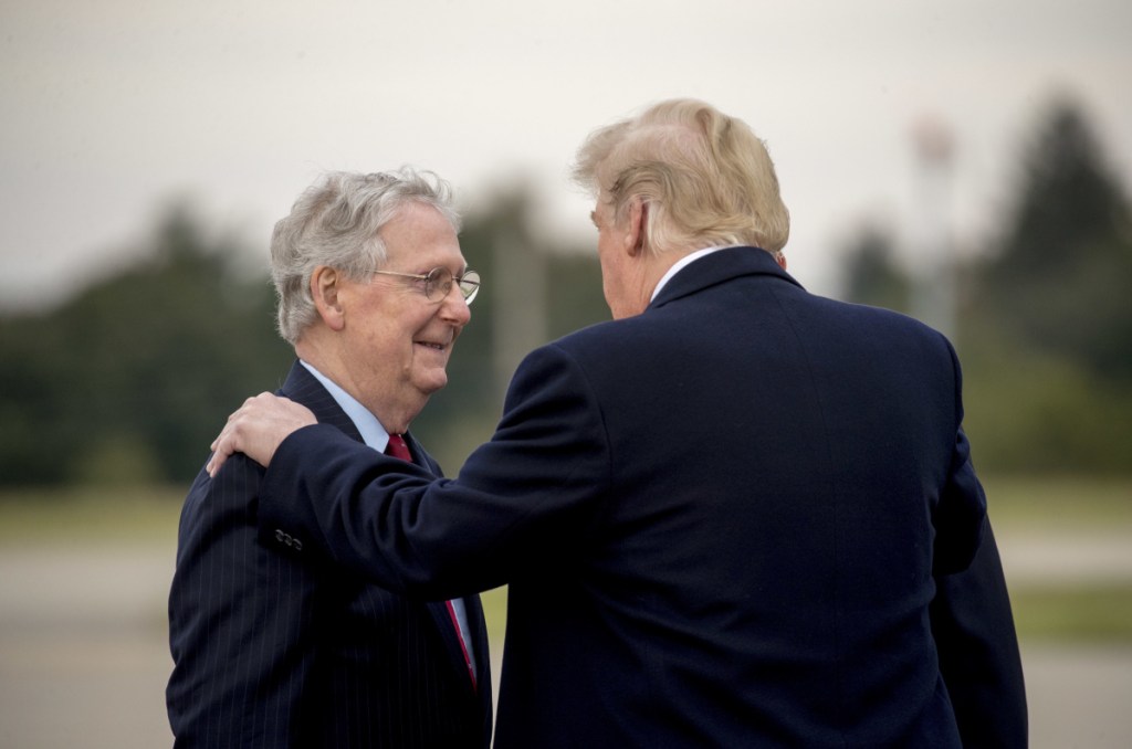 President Trump speaks with Senate Majority Leader Mitch McConnell, left, in Lexington, Ky., on Oct. 13.