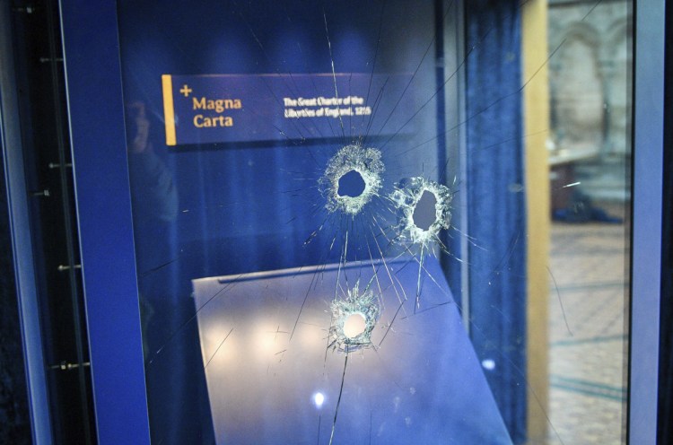 Hammer holes in the glass case that housed the Magna Carta after a robbery attempt o  Thursday.