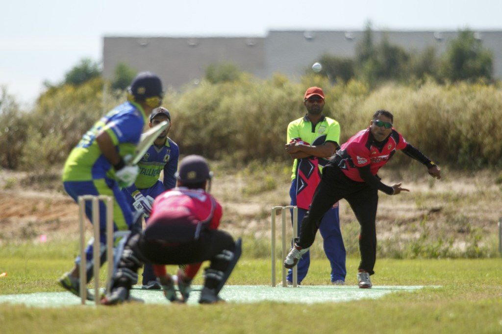 Bowler and batsman square off during a championship game on Oct. 21 at the nascent Prairie View Cricket Complex outside Houston. (Photo for The Washington Post by Michael Stravato)