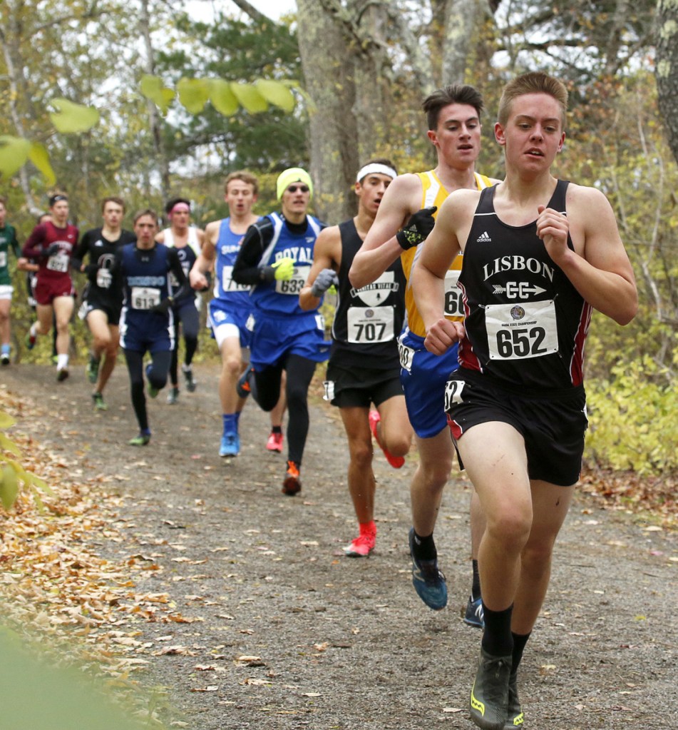 Runners form a line behind Lisbon's David Schlotterbeck during the Class C boys' race. Schlotterbeck finished sixth, about 30 seconds behind winner Henry Spritz of Waynflete.