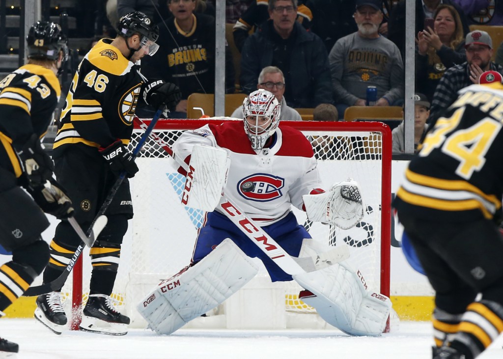 Canadiens goaltender Carey Price makes a save with David Krejci of the Bruins on the doorstep during Montreal's 3-0 victory in Boston on Saturday night.