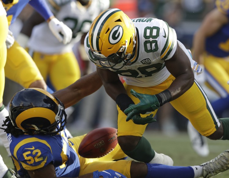 Green Bay kickoff returner Ty Montgomery gets the ball stripped loose by Ramik Wilson of the Rams for a fumble that helped Los Angeles clinch a 29-27 win Sunday.