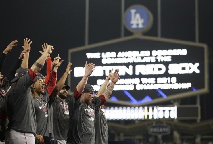 The Boston Red Sox celebrate after Game 5 of the World Series on Sunday in Los Angeles. The Red Sox beat the Dodgers, 5-1, to win the series 4 games to 1. (AP Photo/Jae C. Hong)