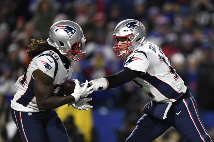 Patriots quarterback Tom Brady hands off to wide receiver Cordarrelle Patterson, who played at times in the backfield and rushed 10 times for 38 times against the Buffalo Bills.