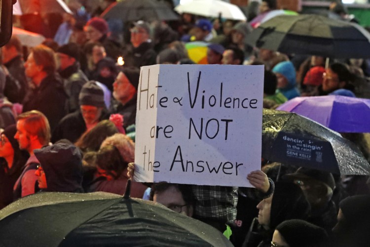 A boy holds a sign Saturday in Pittsburgh at a vigil for victims of the shooting at the Tree of Life synagogue. The massacre is tragic but unsurprising given President Trump’s vitriol, a reader says.