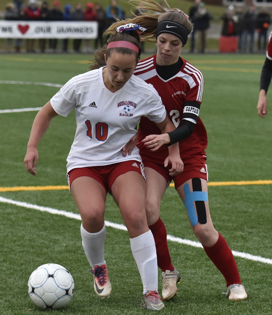 Messalonskee's Caitlyn Parks, left, and Grace Blackwell of Camden Hills compete for possession of the ball during Wednesday's regional final.