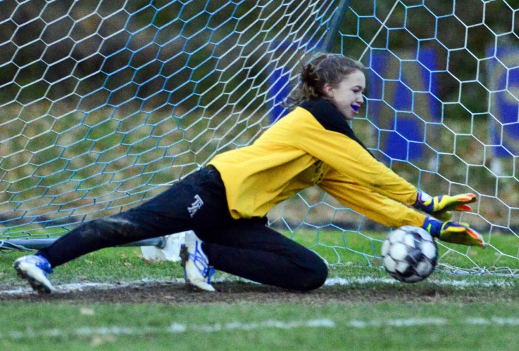 Traip Academy keeper Olivia O'Leary makes a save during penalty kicks in Wednesday's Class C South girls' soccer final. Maranacook outscored Traip 4-3 in penalty kicks to win 1-0.