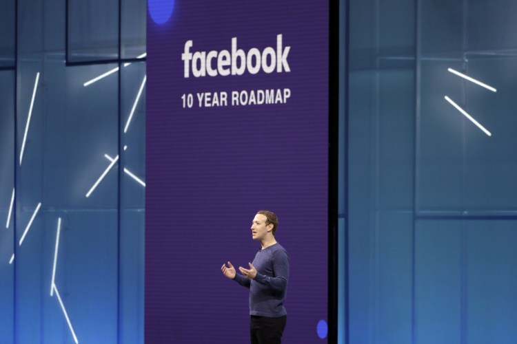 Facebook CEO Mark Zuckerberg speaks at F8, Facebook's developer conference in San Jose, Calif., in May. The company is spending heavily to boost security, moderating content and investing in new technologies such as artificial intelligence.