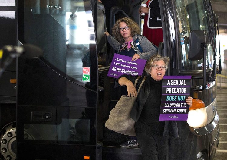 Susan Feiner, front, gets off a bus at Union Station in Washington, D.C., with a group of Mainers on Oct. 4. The group traveled from Maine overnight in hopes of meeting with Sen. Susan Collins to voice their opposition to then-Supreme Court nominee Brett Kavanaugh. Feiner, a retired USM professor, has been barred from teaching because she offered students a “pop-up” course for credit to take the bus to D.C. with demonstrators. 