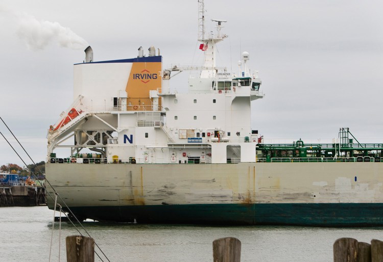 An Irving oil tanker sails through Portland Harbor on Monday.