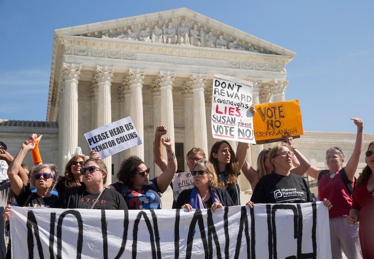 Demonstrators from Maine chant "Susan Collins, we're your voters" at a rally against Brett Kavanaugh on Thursday outside the Supreme Court in Washington, D.C.