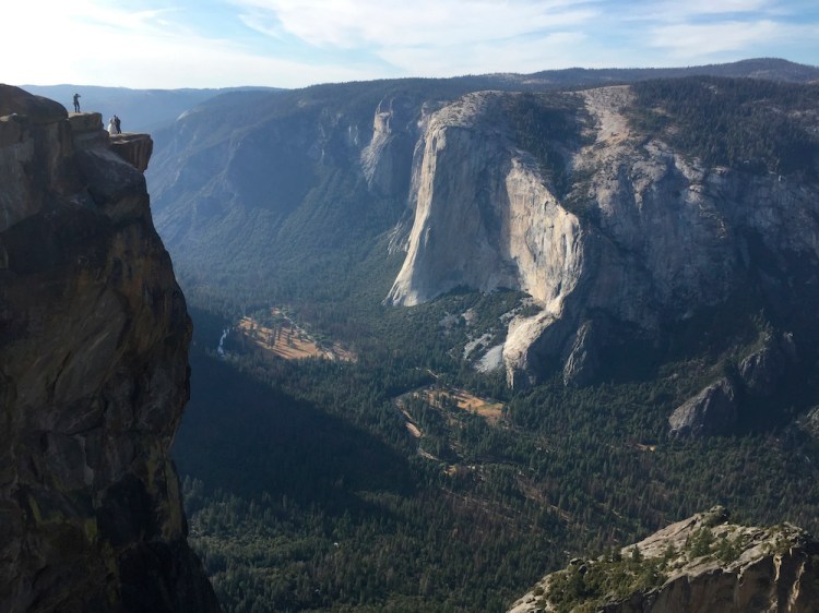 A wedding couple are seen being photographed at Taft Point in California's Yosemite National Park in September.