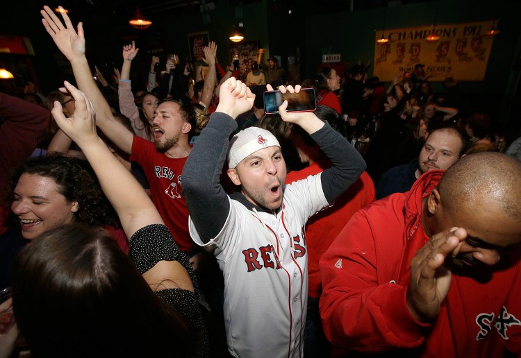 Red Sox fans celebrate their team's World Series-clinching win Sunday night in Boston. Next up: another duck boat parade. 