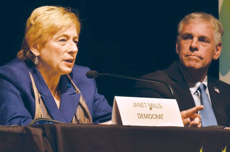 Democrat Janet Mills and Republican Shawn Moody, shown at a debate in Waterville on Oct. 4, aren't putting much stock in a new poll showing Mills with an 8-point lead in the race for governor.