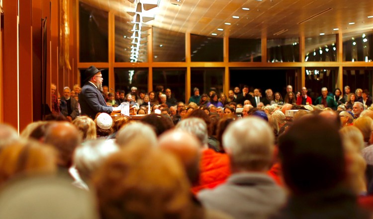 Rabbi Moshe Wilansky addresses an overflow crowd during a vigil at Congregation Bet Ha'am in South Portland on Oct. 30. The gathering was held to commemorate the 11 people killed at a Pittsburgh synagogue three days earlier. On Monday, the Portland City Council approved a resolution condemning hate and discrimination. 