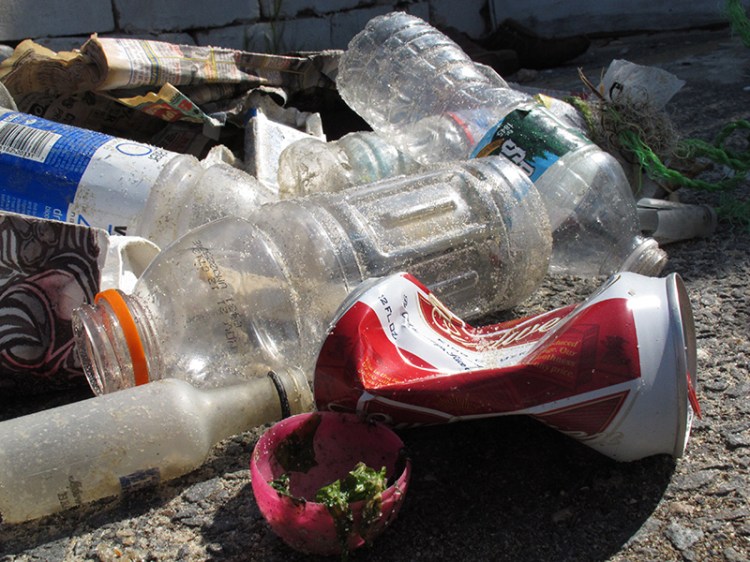 Beer, liquor, water and soft drink bottles, along with half a plastic Easter egg collected by volunteers in a 2012 beach cleanup in New Jersey.