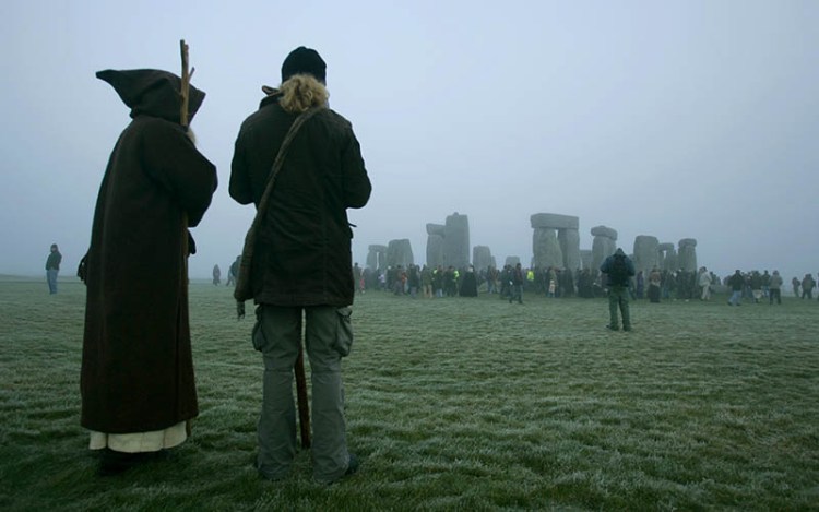 A worshipper of the Pagan Wiccan religion, left, and a friend stand near the ancient stone monument of Stonehenge in 2006. Canada's law originated from a British statute from 1735,