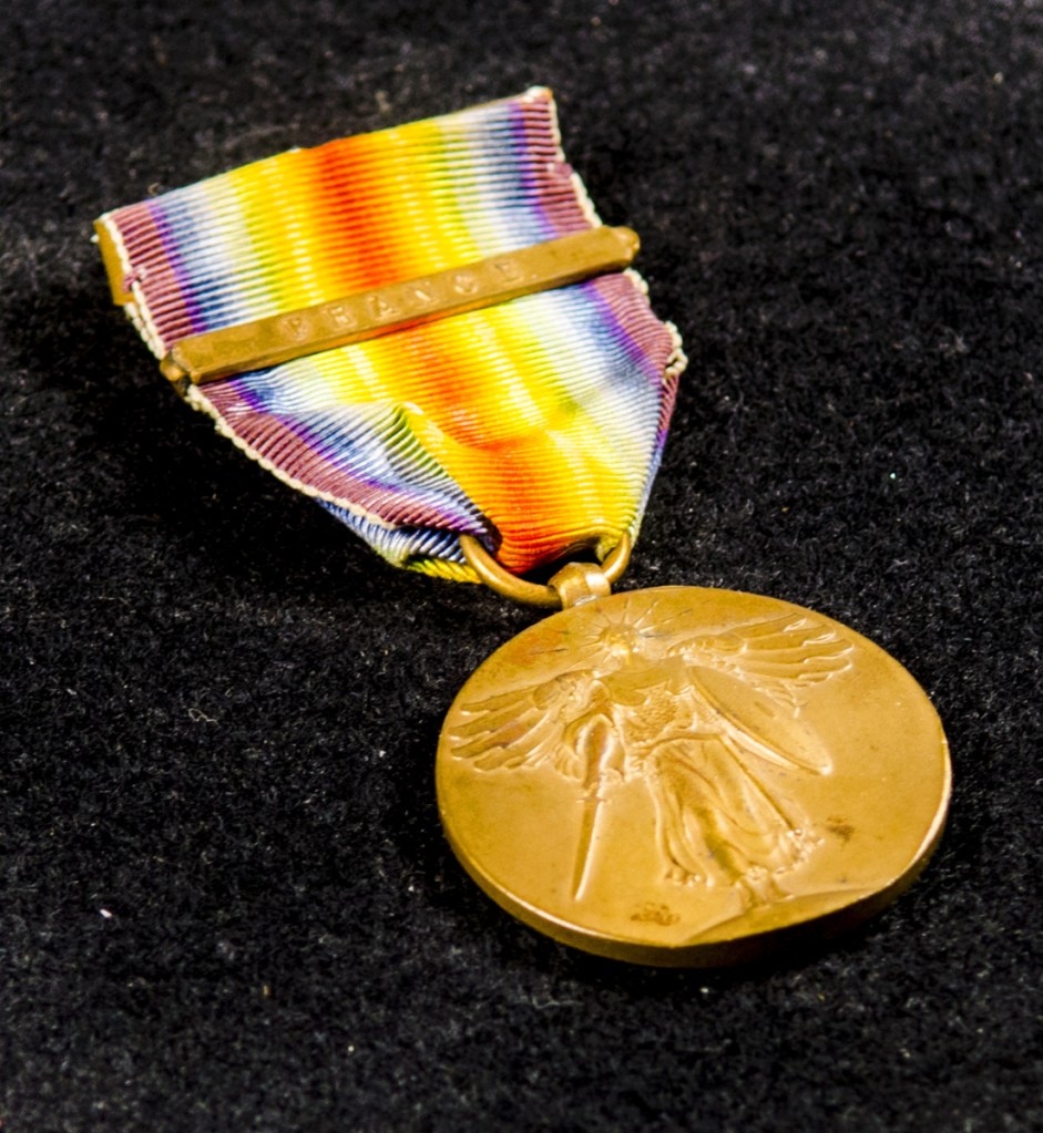William Thomas Hawkens' World War i Victory Medal is photographed Saturday in the Cultural Building in Augusta. Pamela Poisson brought in several items related to her grandfather William Thomas Hawkens' time in the Army.