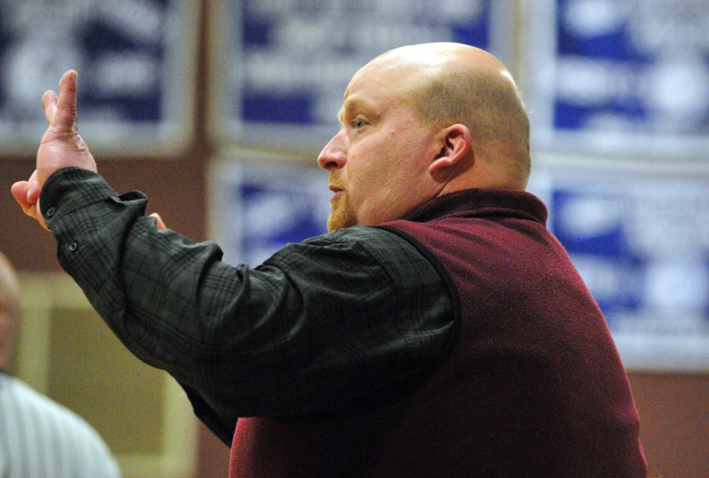 Monmouth girls basketball coach Scott Wing shouts instructions to his team against Searsport during a 2017 Class C South prelim game in Monmouth.