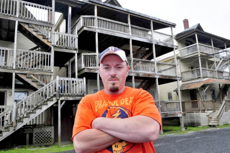 Bobbi Frappier stands outside the Waterville apartment building known as the "Beehive" on June 25, 2013. Frappier was 12 years old when he found his grandmother Martha Daigle murdered in 1989 in the building. Alan Powell was convicted for the murder and died at the Maine State Prison after an altercation with convicted murderer Guy Hunnewell lll.