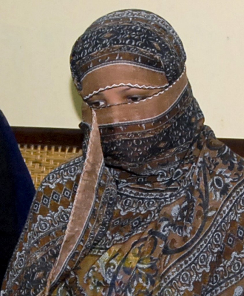 Asia Bibi, a Pakistani Christian woman, listens to officials at a prison in Sheikhupura near Lahore, Pakistan, in 2010.