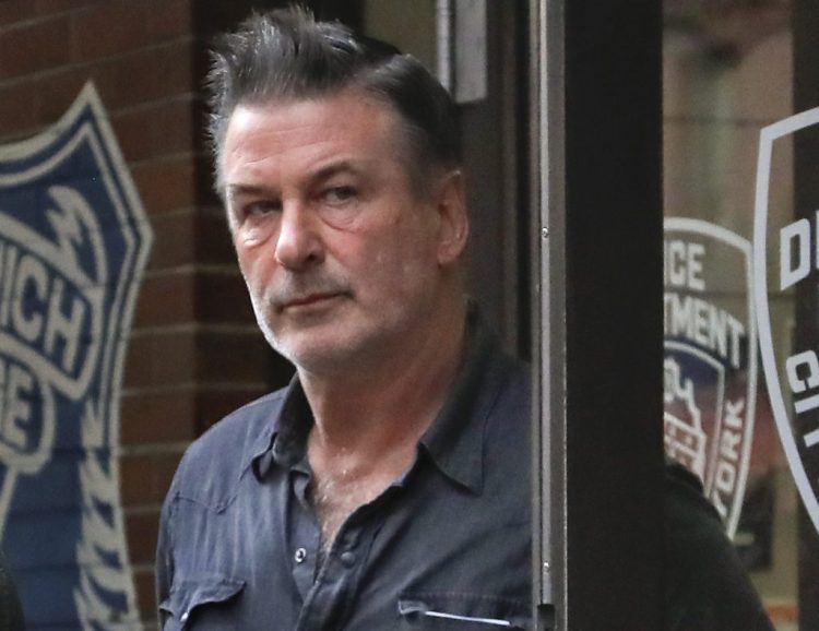 Actor Alec Baldwin leaves the New York Police Department's 10th Precinct on Friday.