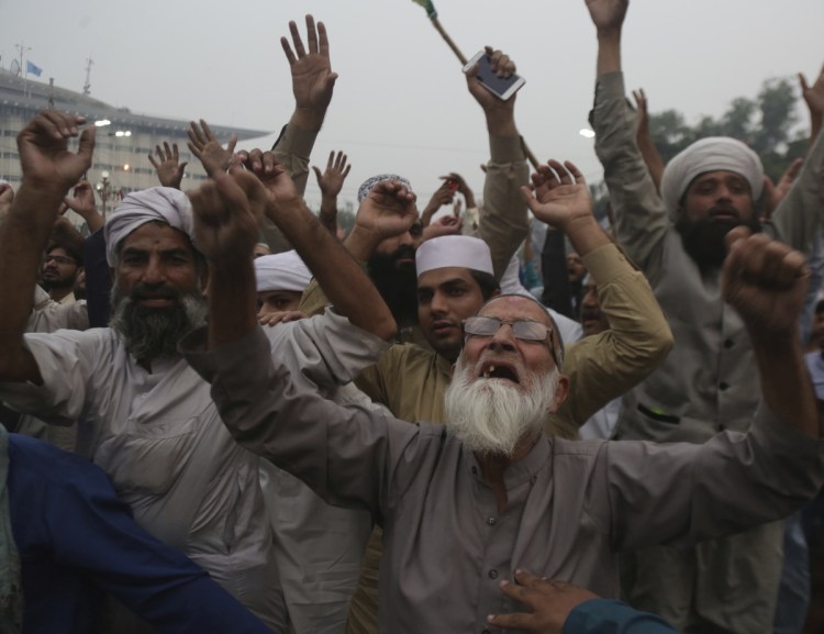 Protesters rally against the Pakistan Supreme Court decision that acquitted Asia Bibi, a Christian woman, who spent eight years on death row accused of blasphemy, in Lahore, Pakistan, on Friday. Bibi's lawyer, Saiful Malook, has left the country after receiving death threats.