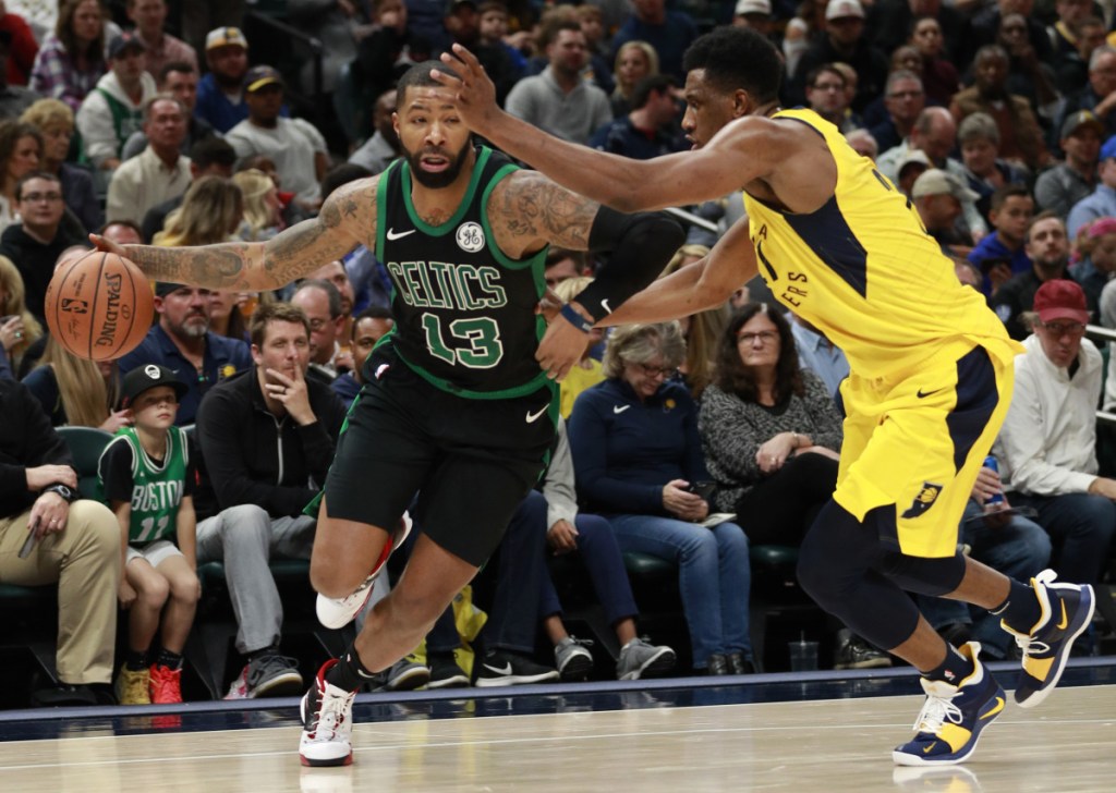 Celtics forward Marcus Morris drives against Indiana's Thaddeus Young during the Pacers' 102-101 Saturday night in Indianapolis. (Associated Press/R Brent Smith)