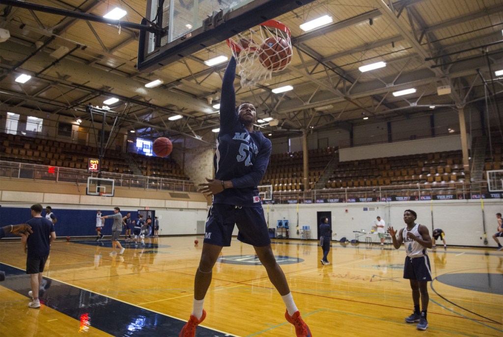 Vincent Eze dunks during UMaine's first practice, Sept. 26 in Orono. The Black Bears open their season Tuesday under new head coach Richard Barron, the former Maine women's coach.