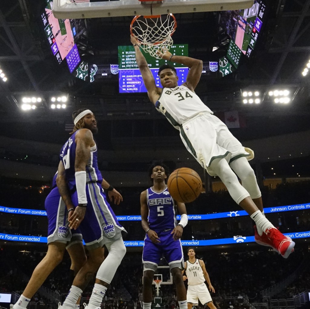 Giannis Antetokounmpo of the Bucks dunks during the second half Milwaukee's 144-109 home rout of the Kings on Sunday. The Bucks improved to 8-1.