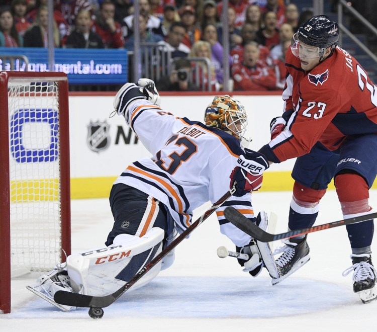 Dmitrij Jaskin of the Washington Capitals tries to get the puck past Edmonton Oilers goaltender Cam Talbot during the first period of Washington's 4-2 victory at home Monday night.