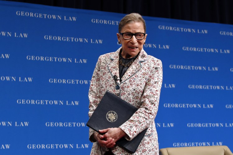 Supreme Court Justice Ruth Bader Ginsburg leaves the stage after speaking to first-year students at Georgetown Law in Washington in  September.