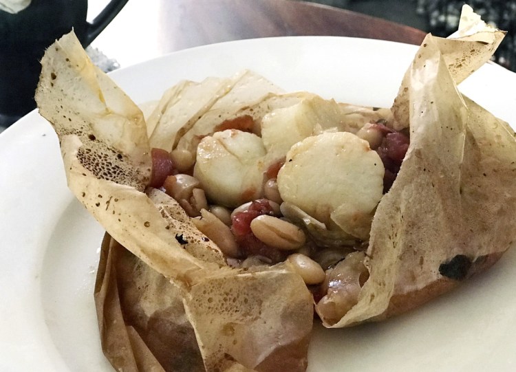 The scallops in this dish were frozen when popped into their parchment packets.
