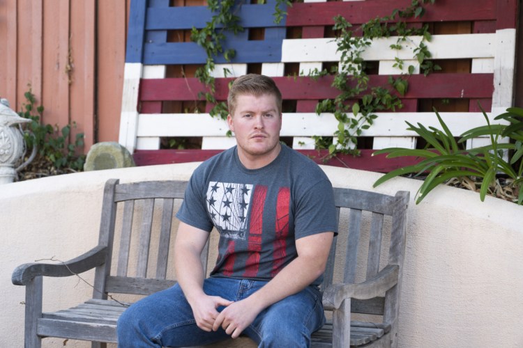 David Anderson, 23, a survivor of the mass shooting at Borderline Bar & Grill and the 2017 Las Vegas shooting at the Route 91 Harvest music festival, sits outside of his home.