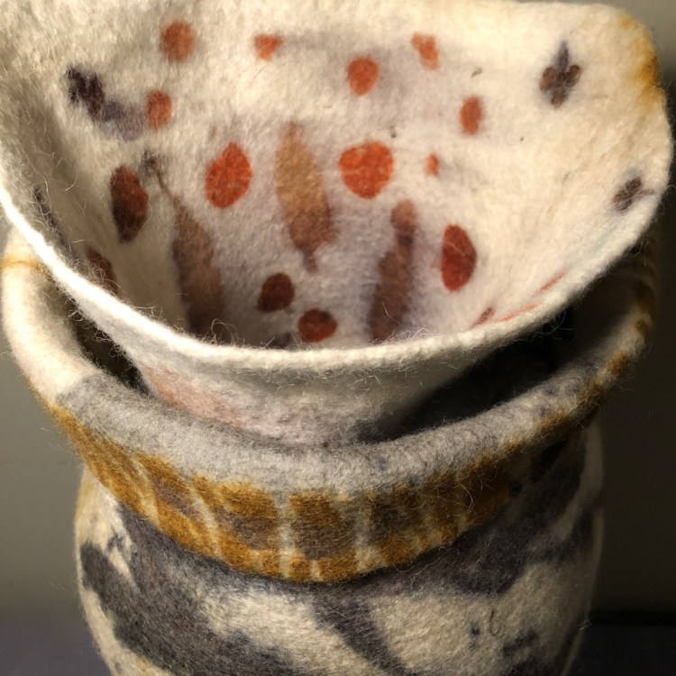 Marina Rheault Post is a UMaine-educated, Chicago-based artist who honed her skills with felt in Iceland and Ireland. Her show features vessels and wall hangings, as well as fiber- and textile-base fashion objects.