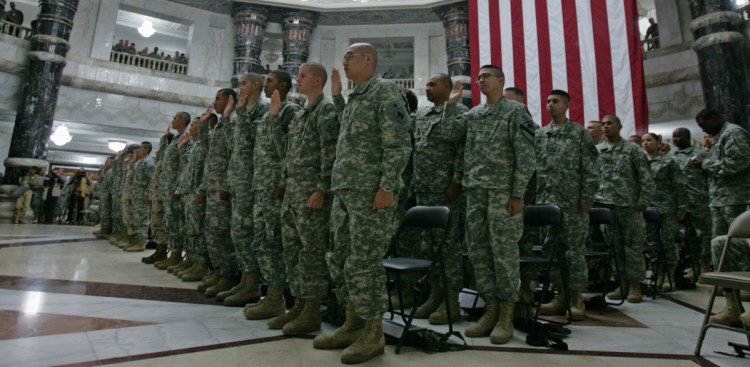 U.S. soldiers take the oath of citizenship in Baghdad in 2008. Military service has long offered immigrants a path to citizenship.
