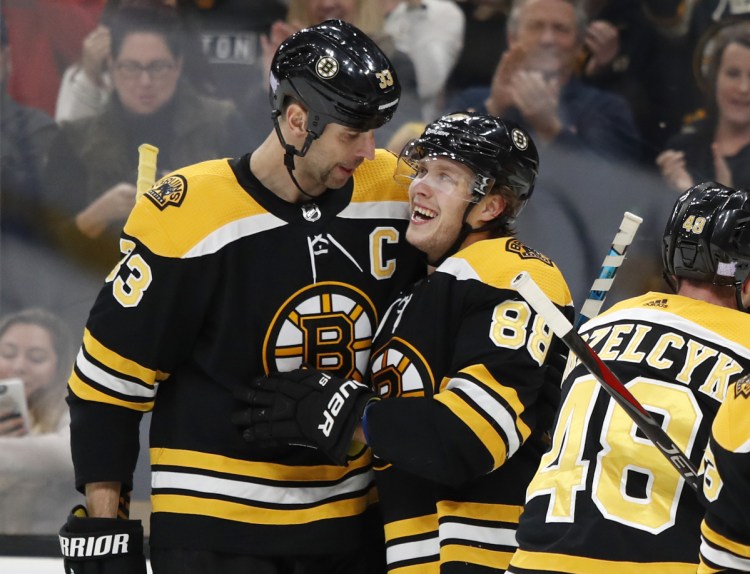 Boston's David Pastrnak, right, is congratulated by Zdeno Chara after scoring against Toronto in the second period of Saturday's game in Boston.