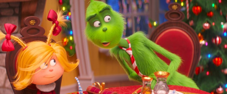 The characters Cindy-Lou Who, voiced by Cameron Seely, left, and the Grinch, voiced by Benedict Cumberbatch, are shown in a scene from "The Grinch." 

