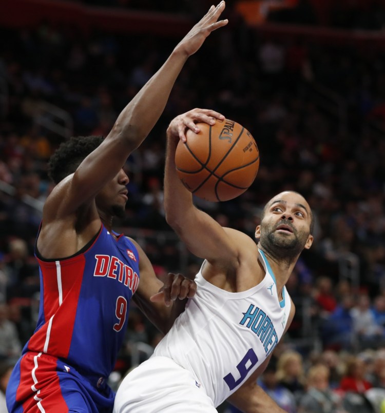 Hornets guard Tony Parker, right, fakes a pass as Pistons guard Langston Galloway defends during Charlotte's 113-103 win at Detroit on Sunday.
