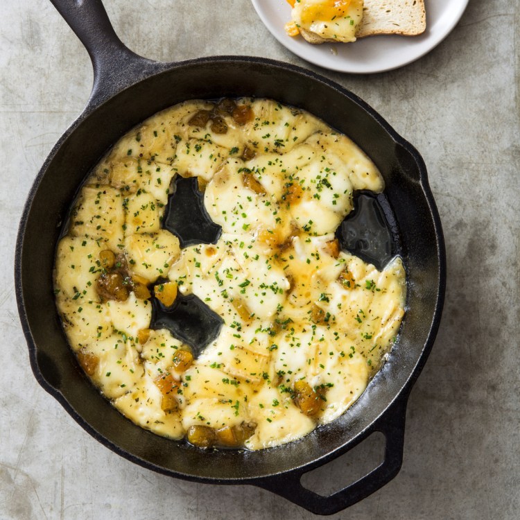 The cast-iron skillet holds on to heat so well that it keeps the cheese in the ideal luscious, fluid state. 