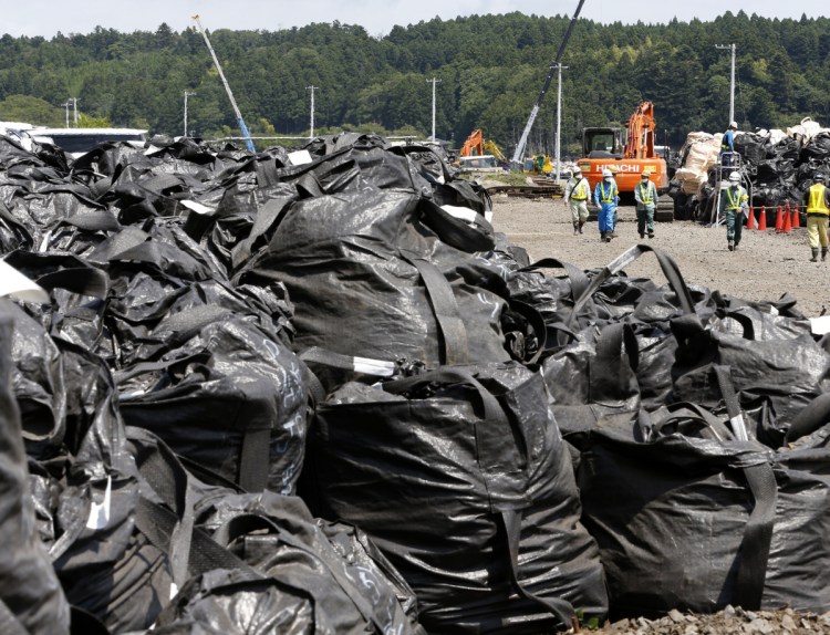 Bags of radioactive waste remain unprocessed at the Fukushima nuclear plant in 2016. Managing nearly 1 million tons of radioactive water is critical to the plant's safe and sustainable decommissioning, a team of experts says.