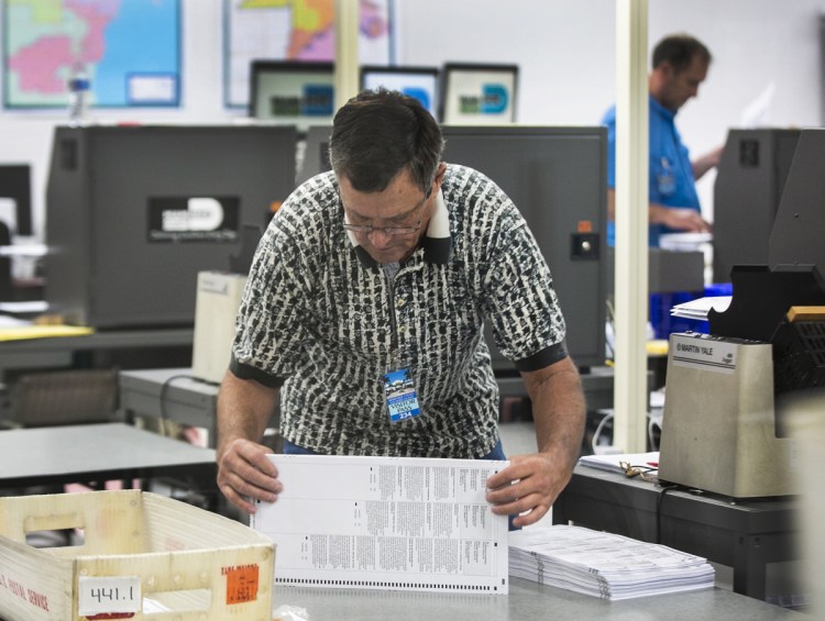 Miami-Dade Election Center supervisors recount the ballots and were already halfway through the recount total on Monday.