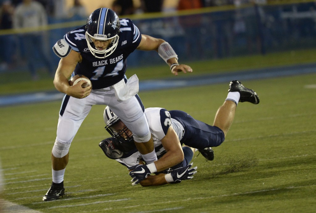 UMaine's Chris Ferguson, shown rushing for a first down against New Hampshire in the season opener, says his latest injury is "not as serious" as the one that caused him to miss nearly three full games earlier this fall. (Staff photo by Shawn Patrick Ouellette/Staff Photographer)