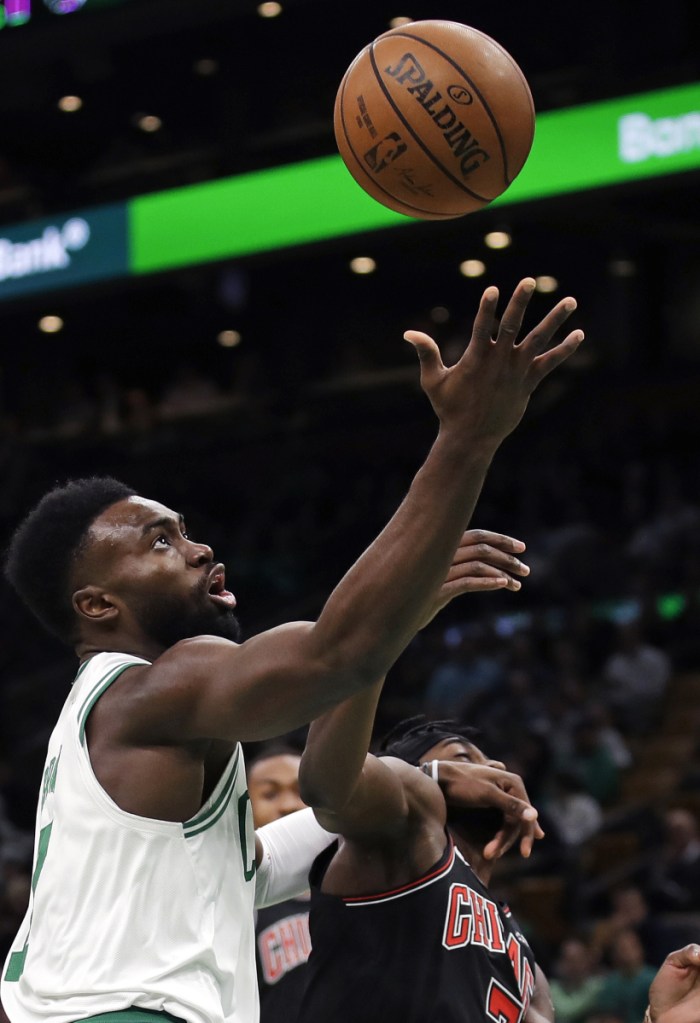Jaylen Brown drives to the basket against Justin Holiday of the Bulls during Boston's 111-82 win Wednesday night at TD Garden. Brown led a balanced offense with 18 points.