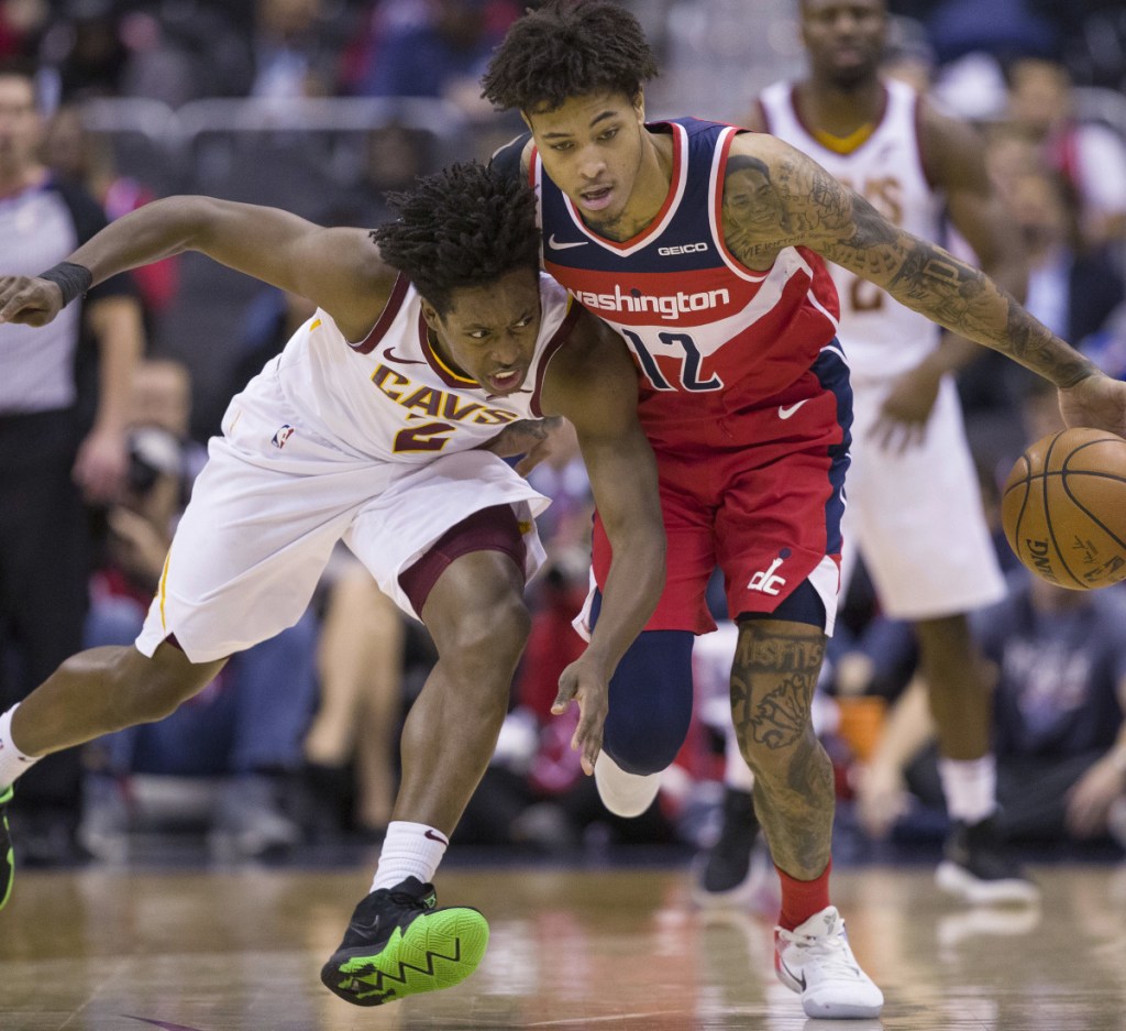 Wizards forward Kelly Oubre Jr., right, steals the ball from Cavaliers guard Collin Sexton during the second half of their game in Washington on Wednesday night. The Wizards won, 119-95.
