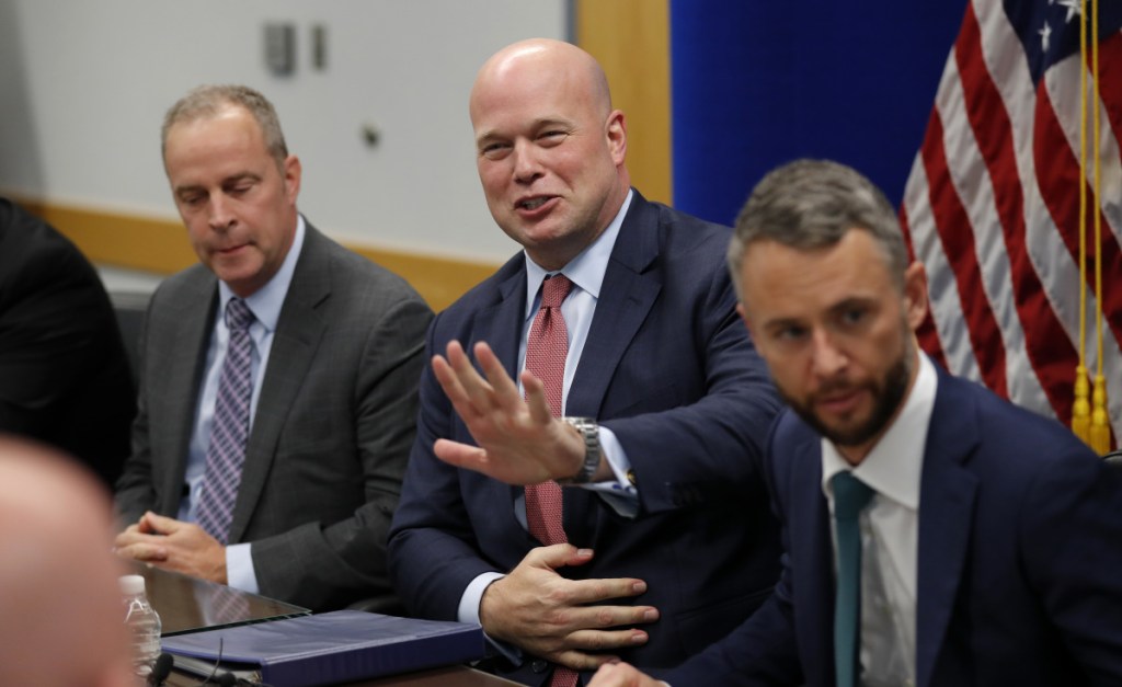 Acting Attorney General Matthew Whitaker, center, greets employees at the U.S. Attorney's Office for the Southern District of Iowa on Wednesday.