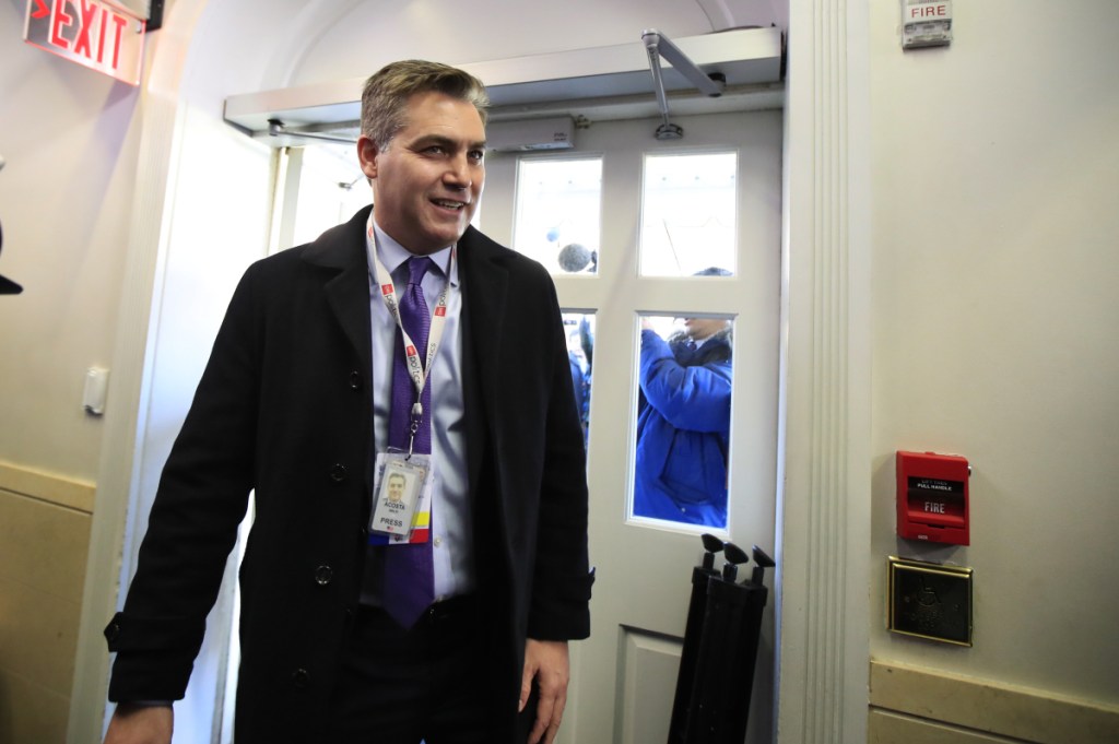 CNN's Jim Acosta enters the Brady press briefing room upon returning back to the White House in Washington on Friday. U.S. District Court Judge Timothy Kelly ordered the White House to immediately return Acosta's credentials, though he will hear more arguments in the case on Monday.