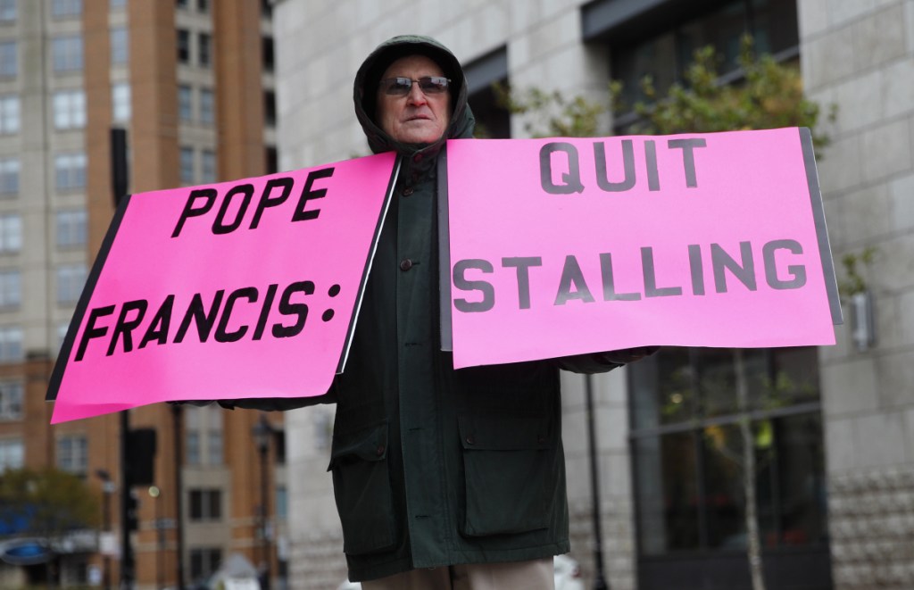 Robert Hoatson of West Orange, N.J., protests outside the U.S. Conference of Catholic Bishops' annual fall meeting Tuesday. Two new lawsuits could complicate the church's attempts to deal with past abuse.