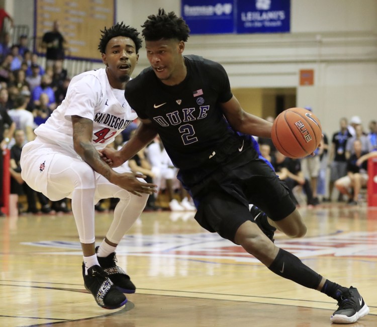 Cam Reddish of Duke drives past Jeremy Hemsley of San Diego State during the second half of Duke's 90-64 victory Monday in Hawaii.